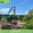 В Дзержинском районе продолжается ремонт моста через реку Шаня
